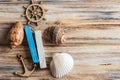 Seashells, wooden anchor and steering wheel