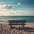 Seashore bench provides serene spot for rest and contemplation Royalty Free Stock Photo