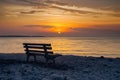 Seashore bench provides serene spot for rest and contemplation Royalty Free Stock Photo