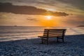 Seashore bench provides serene spot for rest and contemplation Royalty Free Stock Photo