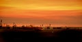 Seashore with boats on a sunset