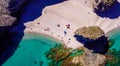 Seashore, coastline, scenic view of people at unspoiled beach in Almeria, called Playa de los Muertos,
