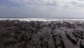 Seashore drone with coral reefs and large waves