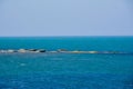 Seashore, rocks, blue water, Caspian sea Royalty Free Stock Photo