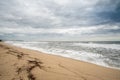 A seashore scene in which high waves come with cloudy weather and strong winds. South Korea Donghae the sea.