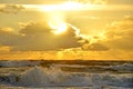 Seashore sky orange tones clouds and sea waves beautiful nature bright sunset dark water Royalty Free Stock Photo