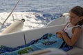 Seasick girl on sailing boat Royalty Free Stock Photo