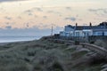 Seaside beach holiday vacation homes in winter. Coastal retreat UK