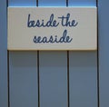 Beside the seaside beach hut sign