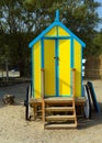 Seaside changing room bath car hut with wooden wheels in yellow and blue