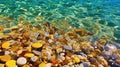 Seaside Colorful Transparent Stones-Pebbles Blue Sea Water at Golden Beach