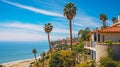 Seaside homes perch on a bluff with panoramic views of the California coastline and tall palms