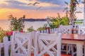 Seaside landscape - the cafe on the embankment view of the Old Town of Nesebar Royalty Free Stock Photo