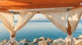 Seaside pergola with curtains in summer morning, travel and holiday background Royalty Free Stock Photo