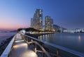 Seaside promenade and high rise residential building in Hong Kong city Royalty Free Stock Photo