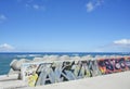 Seaside rampart decorated with graffiti on the Sunset beach in Chatan City in the American Village of Okinawa island in Japan