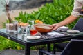 At a seaside restaurant, a waiter serves a table overlooking the ocean Royalty Free Stock Photo