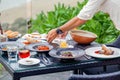 At a seaside restaurant, a waiter serves a table overlooking the ocean Royalty Free Stock Photo