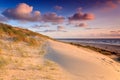 Seaside with sand dunes at sunset Royalty Free Stock Photo