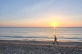 Seaside Serenity: A Peaceful Sunset Walk Royalty Free Stock Photo