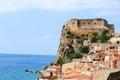 Seaside town Scilla with castle on rock Castello Ruffo. Mediterranean Tyrrhenian sea coast. Scilla, Calabria, Italy. July 2019 Royalty Free Stock Photo