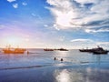 seaside view with boats leaning