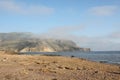 Seaside view - sand, mountain and sea