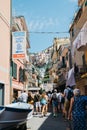 Seaside village Manarola, Colorful buildings and tourist people in Cinque Terre, Italy