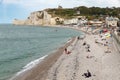 Seaside visitors and fishing boats at beach Etretat, Normandie, France