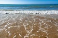 Seaside and waves, beach with sand, water, shell Royalty Free Stock Photo