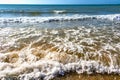 Seaside and waves, beach with sand, water, shell Royalty Free Stock Photo