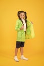 Season is changing. small girl raincoat. active schoolgirl waterproof raincoat. water resistant clothes. good mood. feel Royalty Free Stock Photo