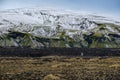Season changing in southern Highlands of Iceland. Colorful Landmannalaugar mountains under snow cover in autumn. Lava fields of