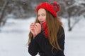 Season christmas or holidays and people concept - smiling young girl in winter clothes outdoor Royalty Free Stock Photo