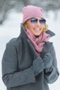 Season, christmas, holidays and people concept - smiling young woman in winter clothes outdoor Royalty Free Stock Photo