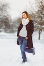 Season, christmas, holidays and people concept - smiling young woman in winter clothes outdoor Royalty Free Stock Photo