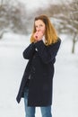 Season, christmas, holidays and people concept - smiling young woman in winter clothes outdoor Royalty Free Stock Photo