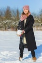 Season, christmas, holidays and people concept - smiling young woman in winter clothes outdoor Royalty Free Stock Photo