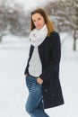 Season, christmas, holidays and people concept - smiling young woman in winter clothes outdoor Royalty Free Stock Photo