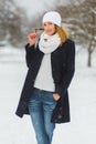 Season, christmas, holidays and people concept - smiling young woman in winter clothes outdoor Royalty Free Stock Photo