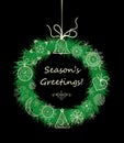 Season greetings with xmas hanging decorative wreath