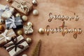 Season`s greetings text, handwritten golden sign at christmas st Royalty Free Stock Photo