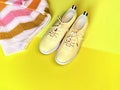 season sale sneakers and jumper on yellow pink   background shoes and clothes  for women summer season fashion trend sport and Royalty Free Stock Photo