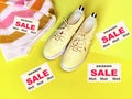 Hot season sale sneakers and jumper on yellow pink   background shoes and clothes  for women summer season fashion trend sport and Royalty Free Stock Photo
