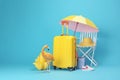 sunglasses yellow background concept travel sun vacation blue suitcase summer flamingo. Generative AI. Royalty Free Stock Photo