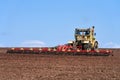 Seasonal agricultural work in the field. Heavy tractor with harrow close-up. Copy space