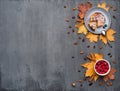 Seasonal autumn background. Frame of colorful maple leaves and a nutmeg, cake, raspberries and cinnamon over grey