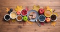 Seasonal autumn background. Frame of maple leaves and a cake over wooden background. Royalty Free Stock Photo