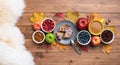 Seasonal autumn background. Frame of maple leaves and a cake over wooden background. Royalty Free Stock Photo