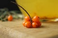 seasonal berries of sea buckthorn orange on the table board and sea buckthorn tea. Seasonal food berry vitamins. Tea to promote